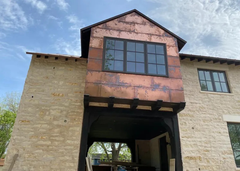 Copper metal panel facade on a stone building for Metal Roof Coating in Templeton