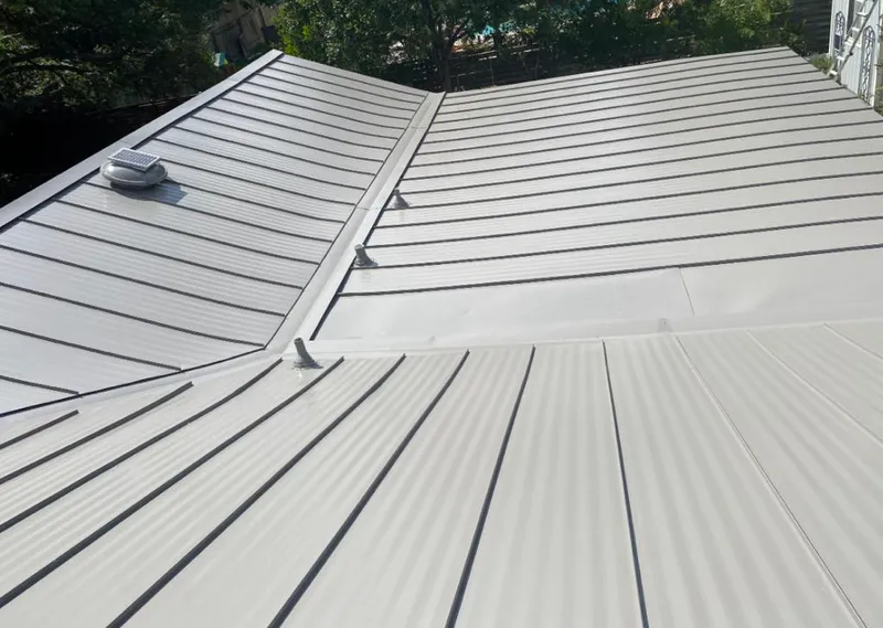 Solar attic fan installed on a metal roof for Roof Ventilation in Templeton